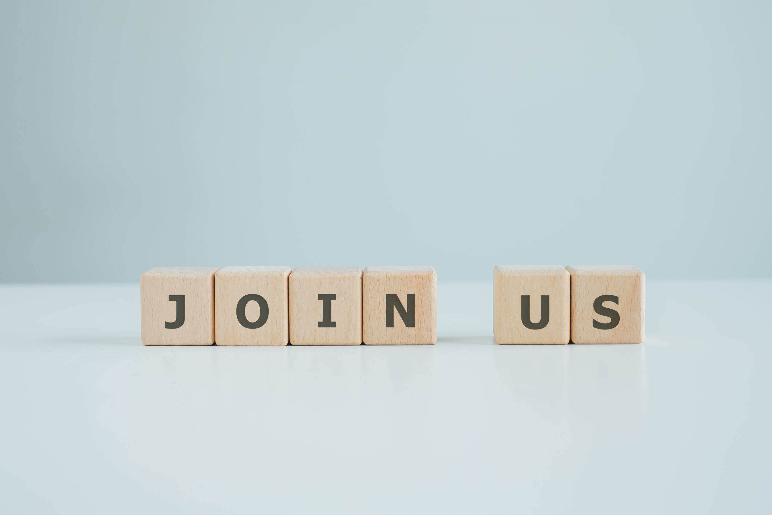 The words JOIN US on wooden cube. Team Recruitment Register Membership Hiring, Human resources management and Business concept.